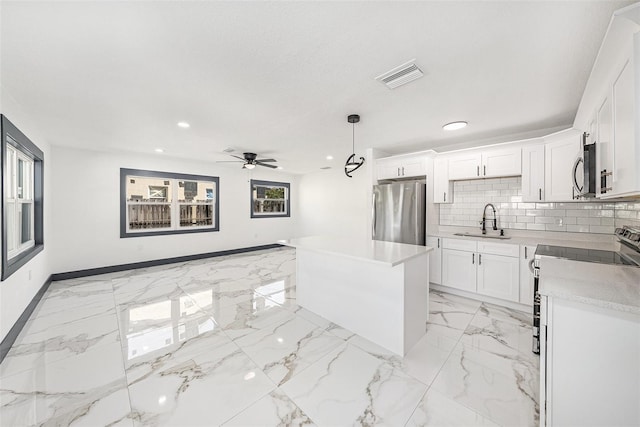 kitchen with a ceiling fan, visible vents, a sink, appliances with stainless steel finishes, and marble finish floor