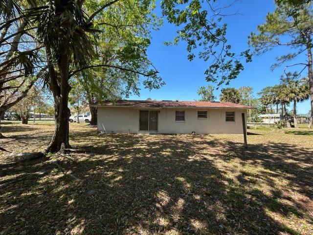 back of property with stucco siding