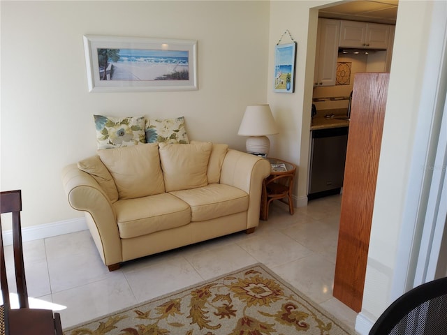 living room with light tile patterned flooring and baseboards