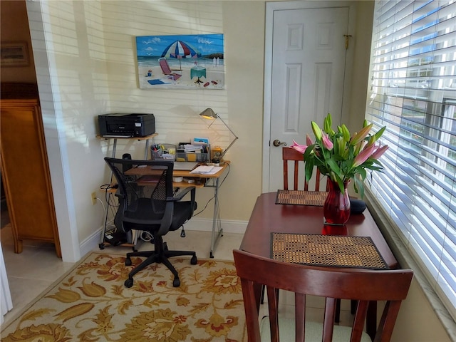 office featuring light tile patterned floors and baseboards