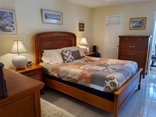 bedroom featuring light tile patterned floors