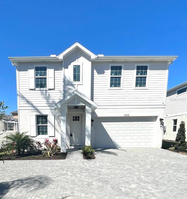 view of front of home with a garage and driveway