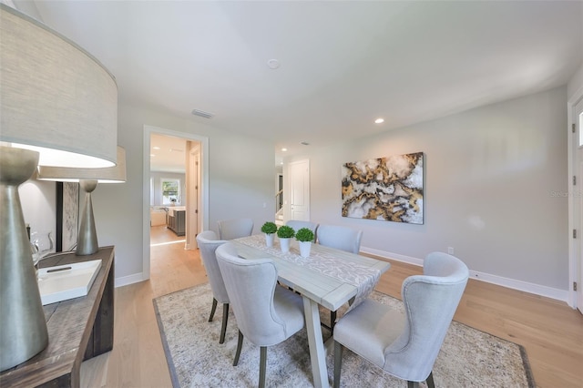 dining space featuring recessed lighting, baseboards, visible vents, and light wood-type flooring