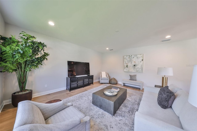 living area featuring recessed lighting, wood finished floors, visible vents, and baseboards