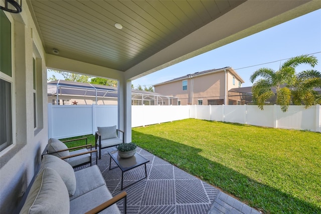 view of patio featuring a fenced backyard and an outdoor living space
