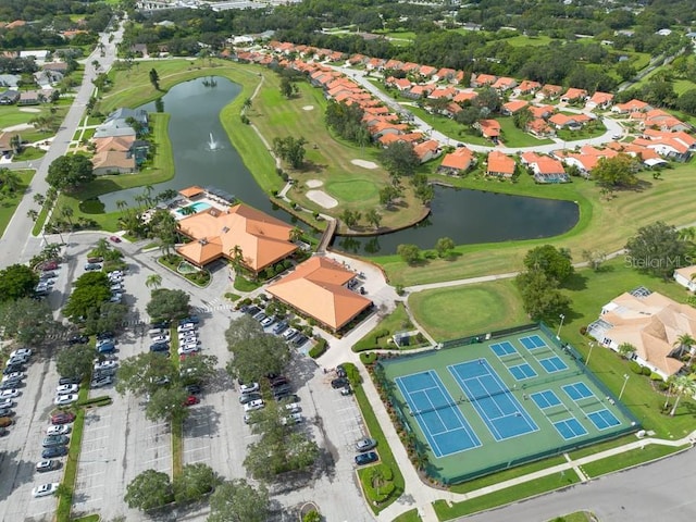 aerial view with a residential view, a water view, and golf course view