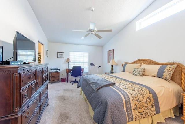 bedroom with light carpet, a textured ceiling, lofted ceiling, and ceiling fan