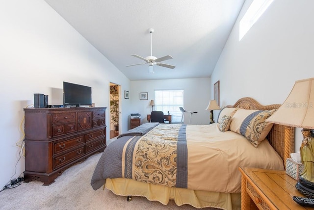 carpeted bedroom featuring high vaulted ceiling and ceiling fan