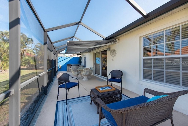 sunroom with lofted ceiling and a healthy amount of sunlight