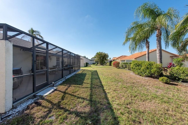 view of yard featuring a lanai