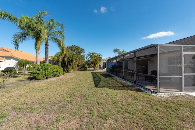 view of yard featuring a lanai