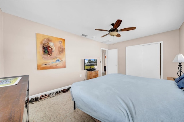 bedroom with visible vents, baseboards, a closet, and ceiling fan