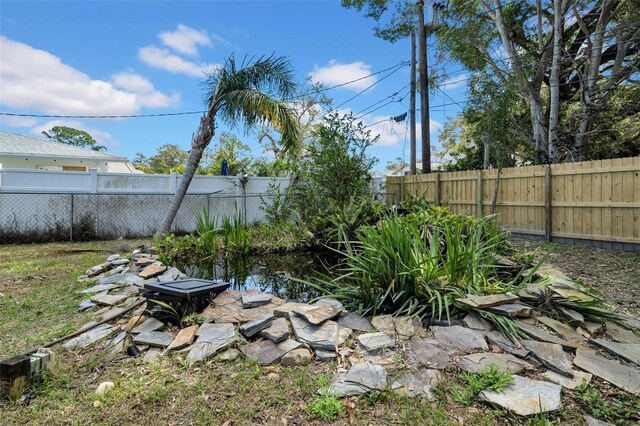 view of yard featuring a fenced backyard