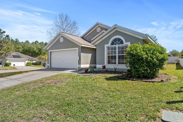 ranch-style house featuring stucco siding, a front yard, concrete driveway, and an attached garage