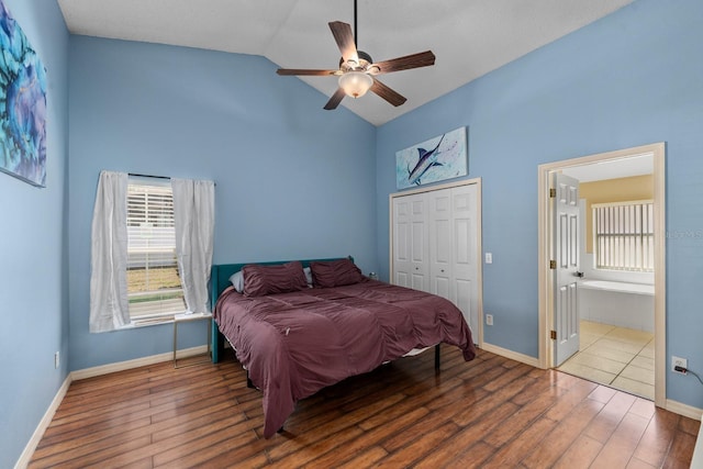 bedroom with a closet, ceiling fan, baseboards, and wood finished floors