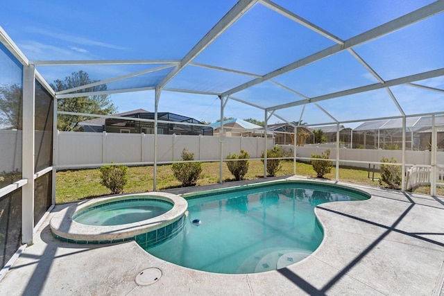 view of pool with a lanai, a patio, a fenced backyard, and a pool with connected hot tub