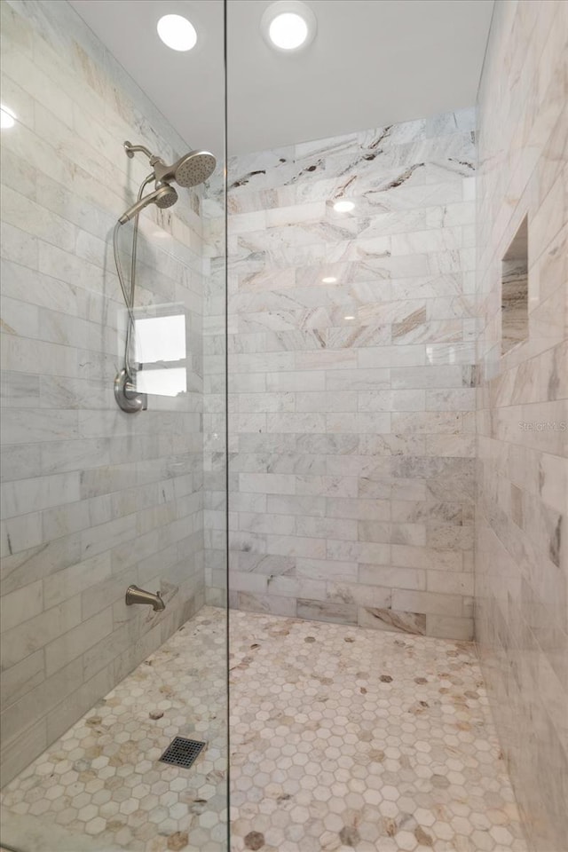 full bath featuring a tile shower