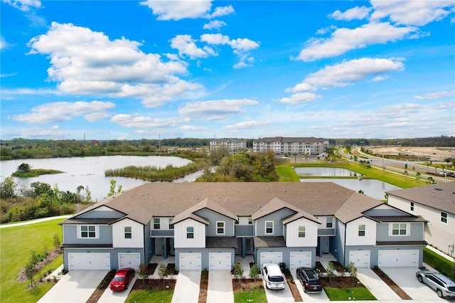 bird's eye view with a residential view and a water view