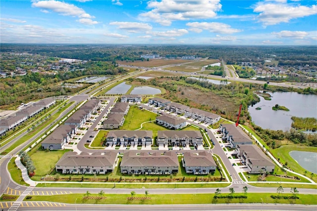 birds eye view of property with a residential view and a water view