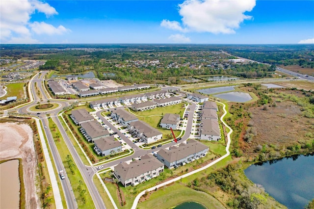 bird's eye view featuring a residential view and a water view