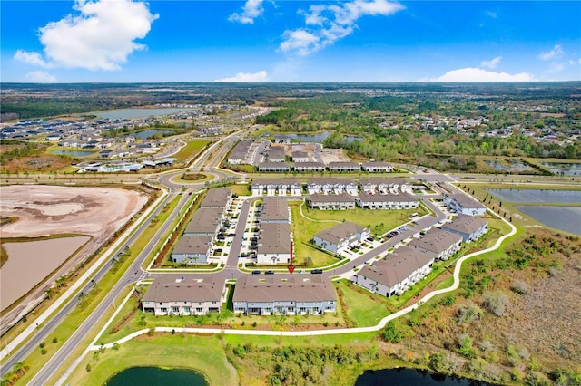 birds eye view of property featuring a water view and a residential view