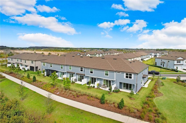 drone / aerial view with a residential view