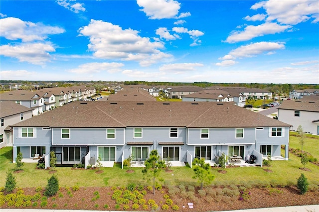 birds eye view of property with a residential view