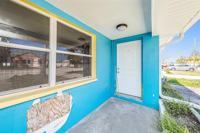 doorway to property with stucco siding