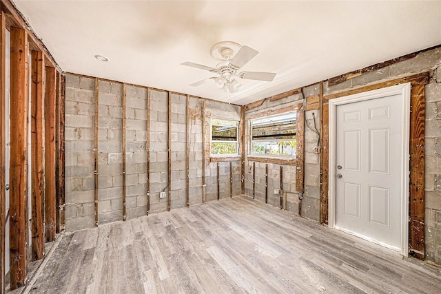 unfurnished room with a ceiling fan and wood finished floors