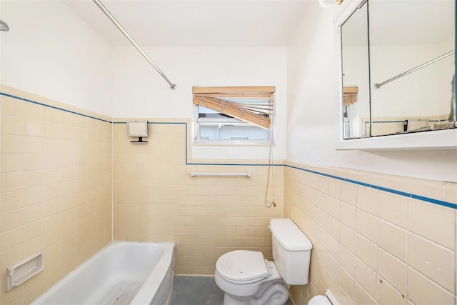 full bath with tile walls, toilet, shower / washtub combination, and wainscoting