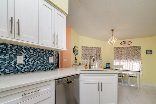 kitchen with a peninsula, a sink, white cabinets, stainless steel dishwasher, and marble finish floor