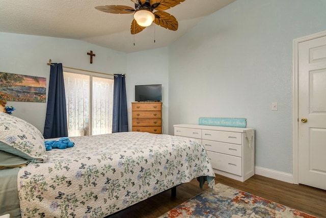 bedroom featuring a ceiling fan, vaulted ceiling, wood finished floors, and baseboards