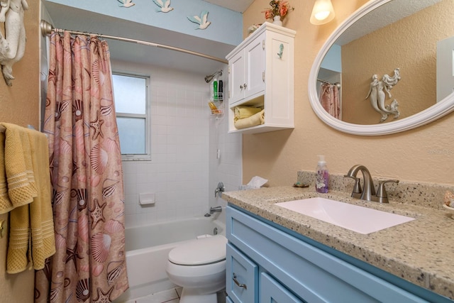 full bathroom with toilet, vanity, shower / bath combo with shower curtain, and a textured wall