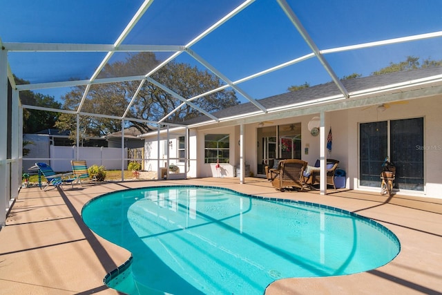 view of swimming pool with a fenced in pool, a patio, a ceiling fan, and fence