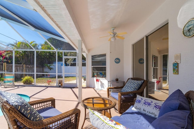 view of patio / terrace with ceiling fan, an outdoor hangout area, glass enclosure, and a fenced backyard