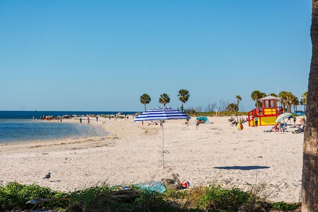 property view of water featuring a beach view