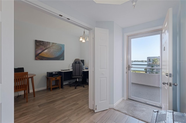 home office with wood finished floors and baseboards