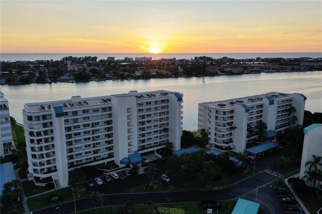 aerial view at dusk with a water view