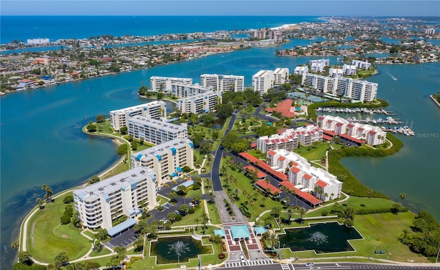 birds eye view of property with a water view and a city view