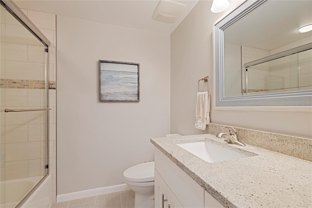 full bath with toilet, vanity, bath / shower combo with glass door, and tile patterned flooring