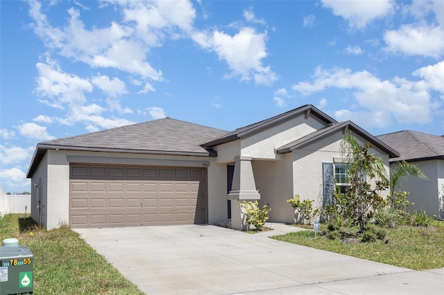 single story home with stucco siding, an attached garage, roof with shingles, and driveway