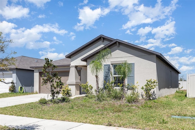 view of front facade featuring stucco siding, an attached garage, driveway, and a front lawn