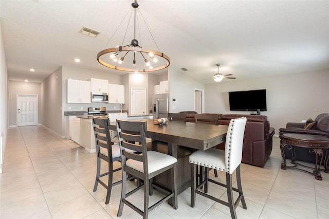 dining room with visible vents, ceiling fan with notable chandelier, recessed lighting, light tile patterned floors, and baseboards