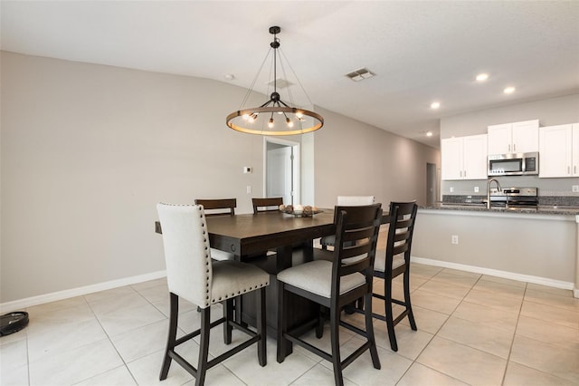 dining room featuring recessed lighting, visible vents, lofted ceiling, and light tile patterned flooring