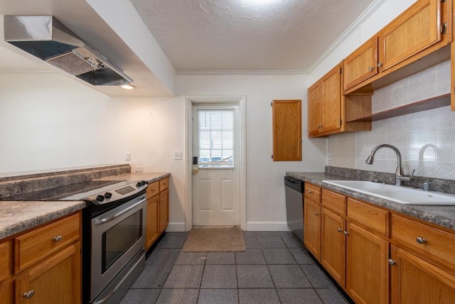 kitchen featuring tasteful backsplash, brown cabinets, stainless steel appliances, wall chimney exhaust hood, and a sink