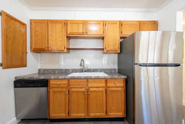 kitchen featuring a sink, dark countertops, tasteful backsplash, and appliances with stainless steel finishes