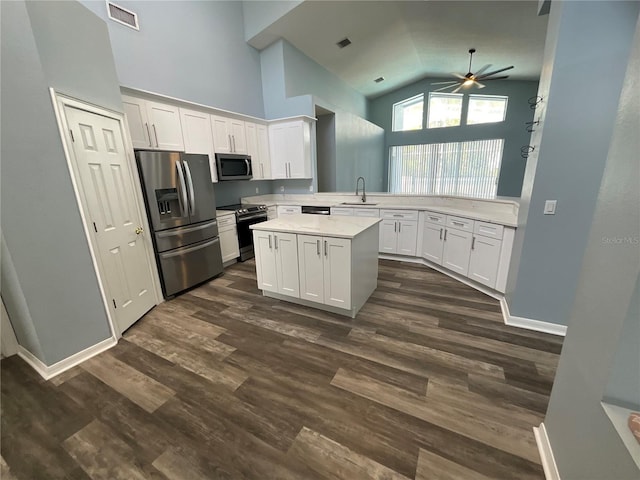 kitchen featuring visible vents, a ceiling fan, a sink, white cabinetry, and appliances with stainless steel finishes