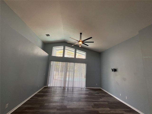 unfurnished room with baseboards, wood finished floors, a ceiling fan, and vaulted ceiling