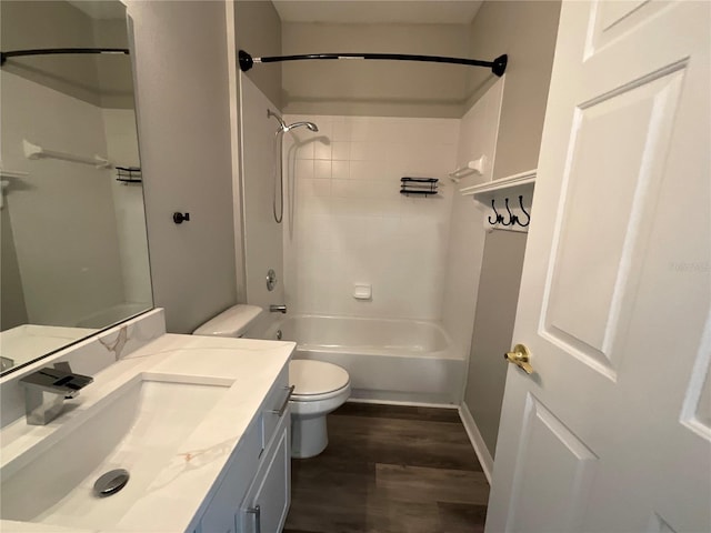 full bathroom with tub / shower combination, toilet, vanity, and wood finished floors