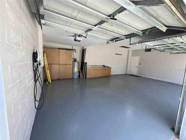 garage with electric water heater and a garage door opener